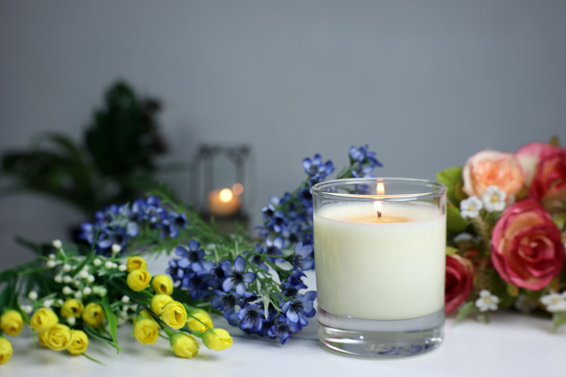 luxury scented candles on the nice table in white bedroom creating relax ambient